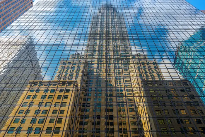 A photo of the Chrysler Building reflecting off the Grand Hyatt